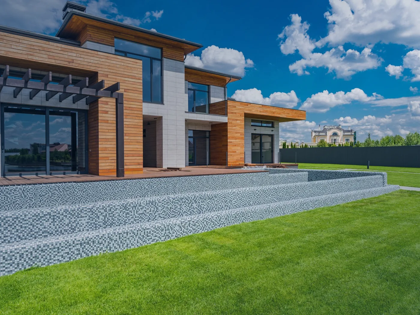A completed modern two-storey house with timber cladding